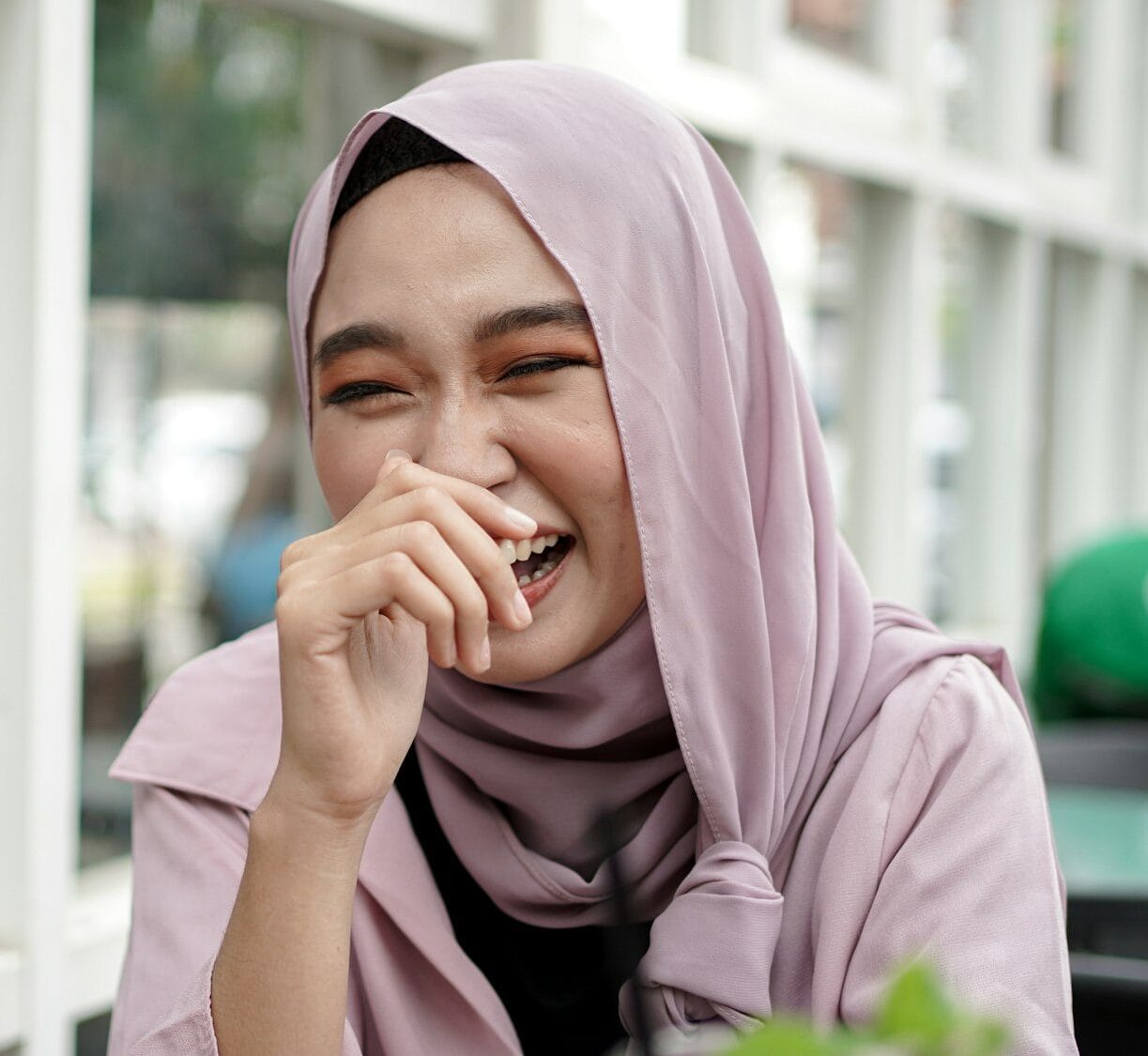 Asian hijab woman activity at cafe with Google Review Management Service Malaysia