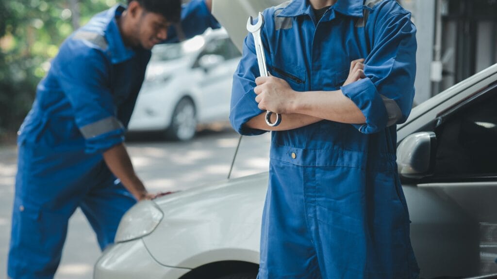 Car mechanic in uniform holding wrench at auto workshop, all kinds of auto specialists, expert auto with Google Review Management Service Malaysia